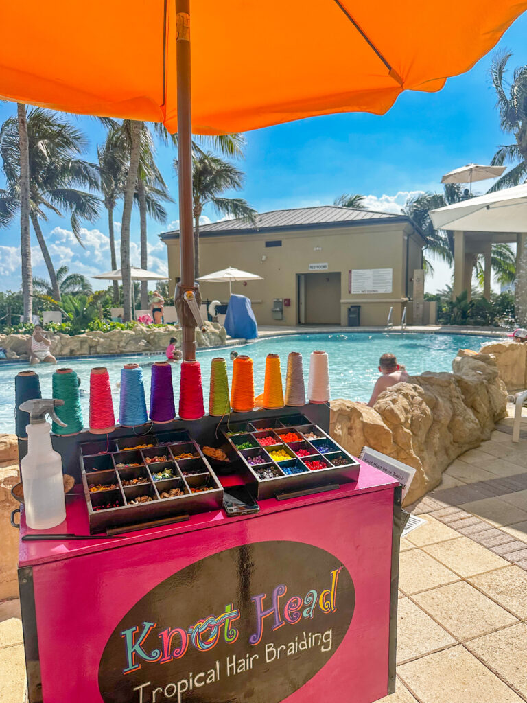 South Florida Beach resort with kid activities -view of hair braiding at pool